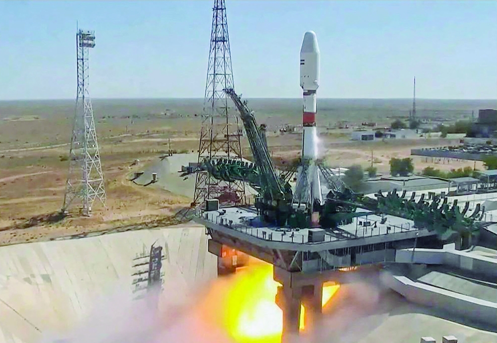 This handout video grab taken and released on Tuesday by the Russian Space Agency Roscosmos shows the Soyuz-2.1b rocket carrying the Khayyam satellite blasting off from a launchpad at the Baikonur Cosmodrome. - AFP