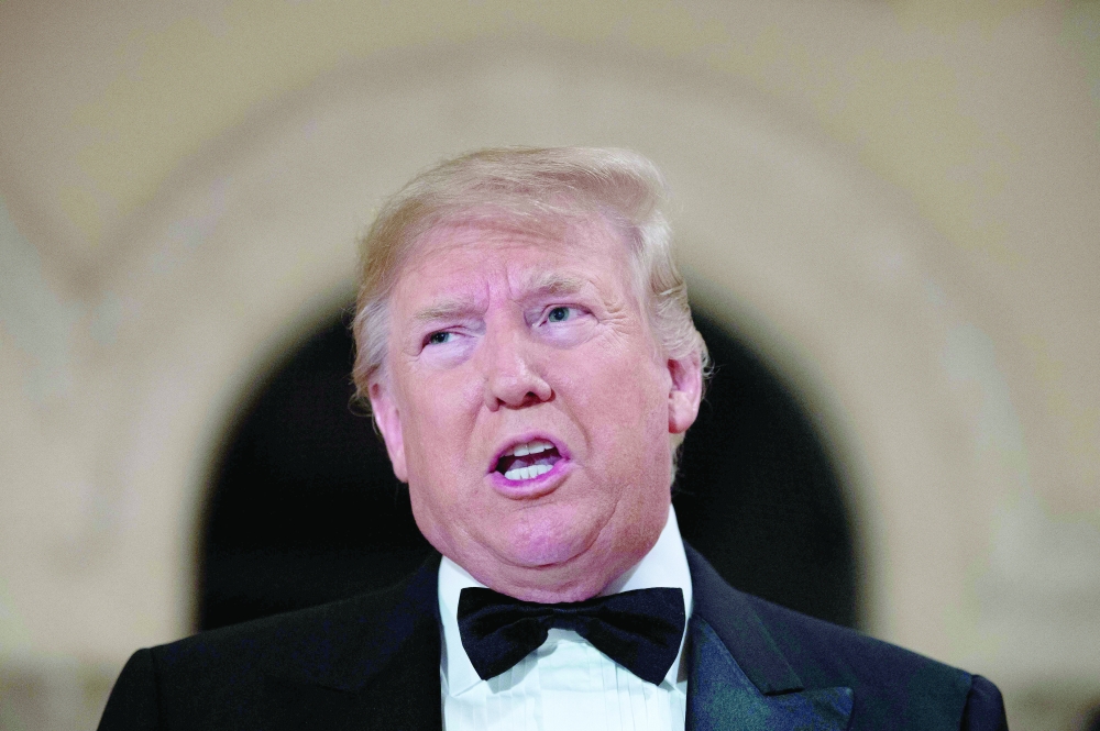 (FILES) In this file photo taken on December 31, 2019 US ppresident Donald Trump speaks to the press outside the grand ballroom as he arrives for a New Year's celebration at Mar-a-Lago in Palm Beach, Florida. Former US president Donald Trump said August 8, 2022 that his Mar-A-Lago residence in Florida was being "raided" by FBI agents in what he called an act of "prosecutorial misconduct." (Photo by JIM WATSON / AFP)