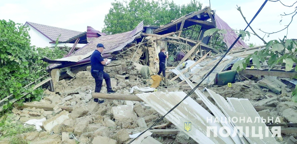 Police officers inspect a residential house destroyed by a Russian military strike in the location given as Marhanets town, in Dnipropetrovsk region, on Wednesday. -- Reuters