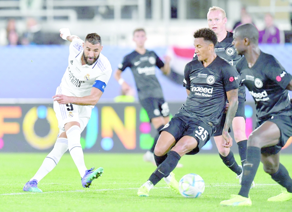 Karim Benzema (L) and Frankfurt's Brazilian defender Tuta vie for the ball during the UEFA Super Cup football match between Real Madrid vs Eintracht Frankfurt in Helsinki, on Wednesday. — AFP