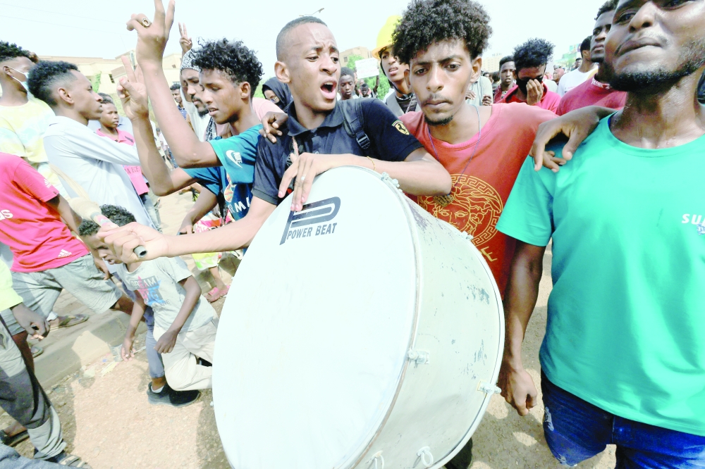 Protesters march through Khartoum during a rally against military rule following the last coup, in Khartoum, on Thursday. - Reuters