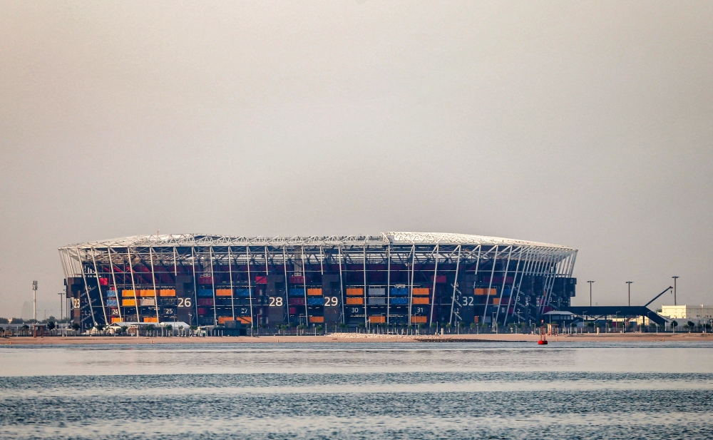 This picture taken early on August 4, 2022 from the Gulf waters off Qatar's capital Doha shows a view of 974 Stadium, formerly knows as Ras Abu Aboud, which will host matches of the FIFA football World Cup 2022.