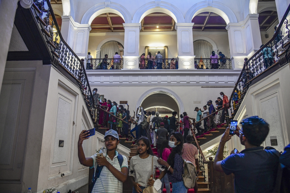 People at the president’s residence in Colombo, Sri Lanka, on July 12, 2022. (Atul Loke/The New York Times)