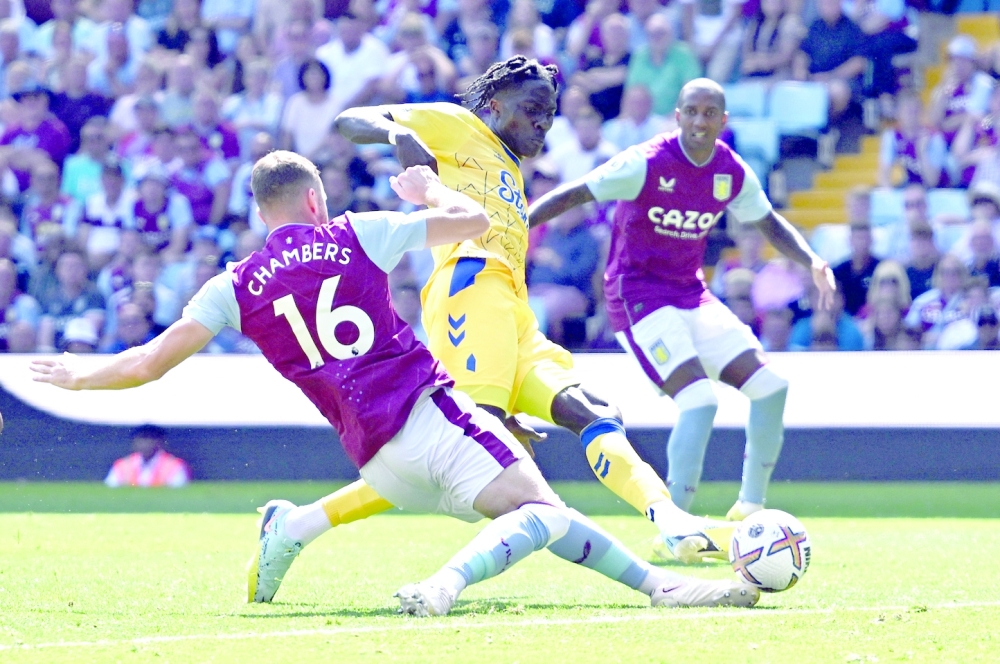 Everton's Amadou Onana in action with Aston Villa's Calum Chambers. — Reuters