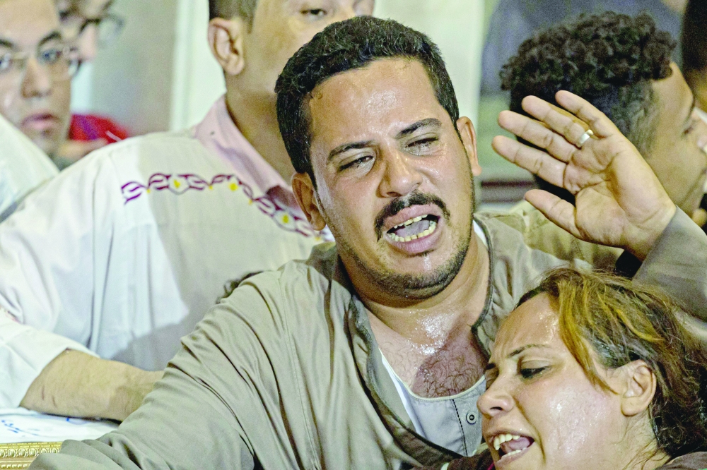 Egyptian mourners during the funeral of victims killed in Cairo Coptic church fire at the church of the Blessed Virgin Mary in the Giza Governorate. -- AFP