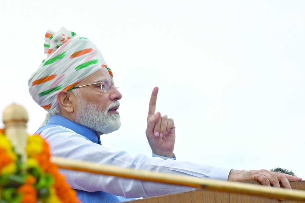 India's Prime Minister Narendra Modi addresses the nation from the ramparts of the Red Fort during the celebrations to mark country's Independence Day in New Delhi. -- AFP