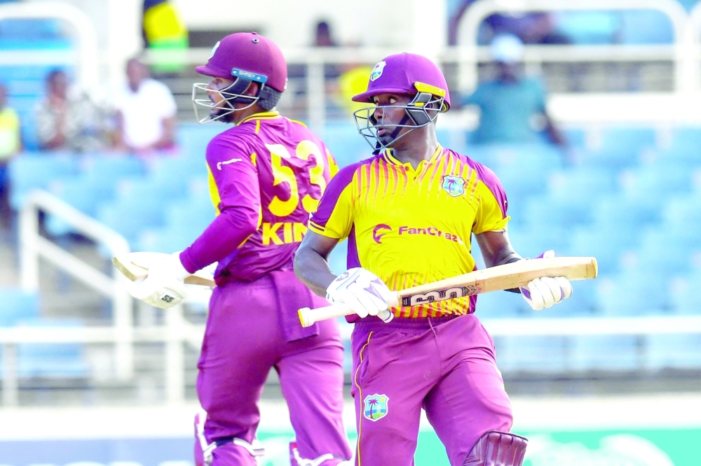 Sharmarh Brooks (R) and Brandon King (L), of West Indies, 100 partnership during the third and final T20i match between West Indies and New Zealand at Sabina Park in Kingston, Jamaica, on August 14, 2022. (Photo by Randy Brooks / AFP)

