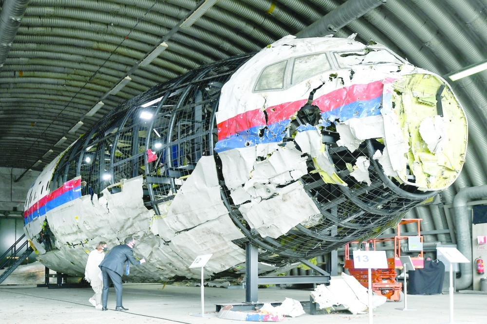 Lawyers attend the judges' inspection of the reconstruction of the MH17 wreckage, as part of the murder trial ahead of the beginning of a critical stage, in Reijen, Netherlands, May 26, 2021. REUTERS/Piroschka van de Wouw/Pool/File Photo
FILE PHOTO: Judges inspect reconstruction of MH17 wreckage, in Reijen