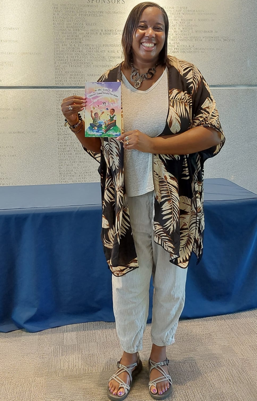 Nicole Brewer holding the book