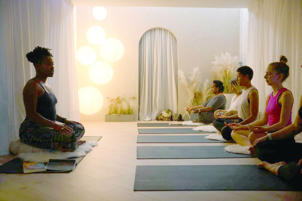 Yoga teacher and author Stacie Graham gives a yoga session at the studio "She
