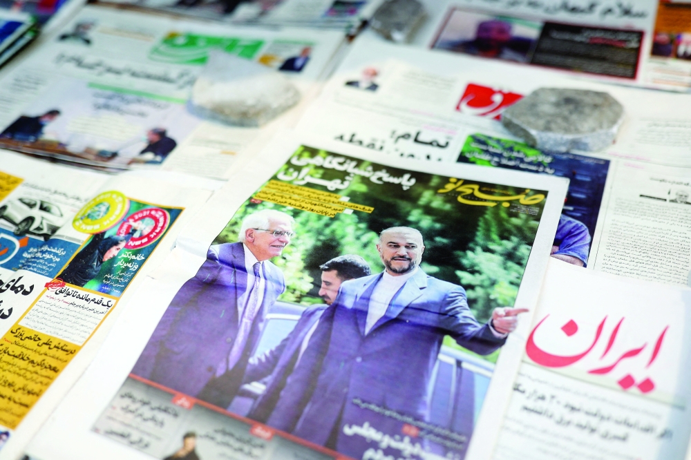 A newspaper with a cover picture of Iranian Foreign Minister Hossein Amir-Abdollahian and High Representative of the European Union for Foreign Affairs and Security Policy Josep Borrell, is seen in Tehran, on Tuesday. - Reuters