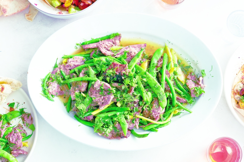 Slow-cooked lamb shoulder with green beans in New York, Aug. 4, 2022. Food styled by Simon Andrews. (David Malosh/The New York Times)