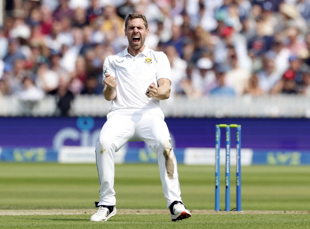 Cricket - First Test - England v South Africa - Lord's Cricket Ground, London, Britain - August 17, 2022 South Africa's Anrich Nortje celebrates after taking the wicket of England's Jonny Bairstow Action Images via Reuters/Peter Cziborra