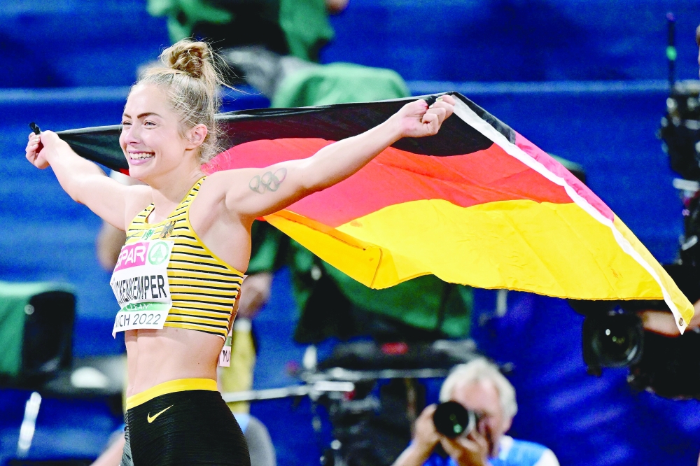 Germany's Gina Luckenkemper celebrates winning the women's 100m final during the European Athletics Championships at the Olympic Stadium in Munich, southern Germany on August 16, 2022. (Photo by ANDREJ ISAKOVIC / AFP)

