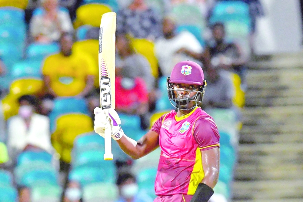 Sharmarh Brooks of West Indies celebrates his half century during the first ODI against New Zealand. -- AFP

