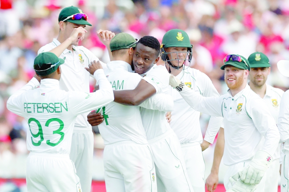 South Africa's Kagiso Rabada celebrates with teammates after taking the lbw wicket of England's James Anderson. -- Reuters