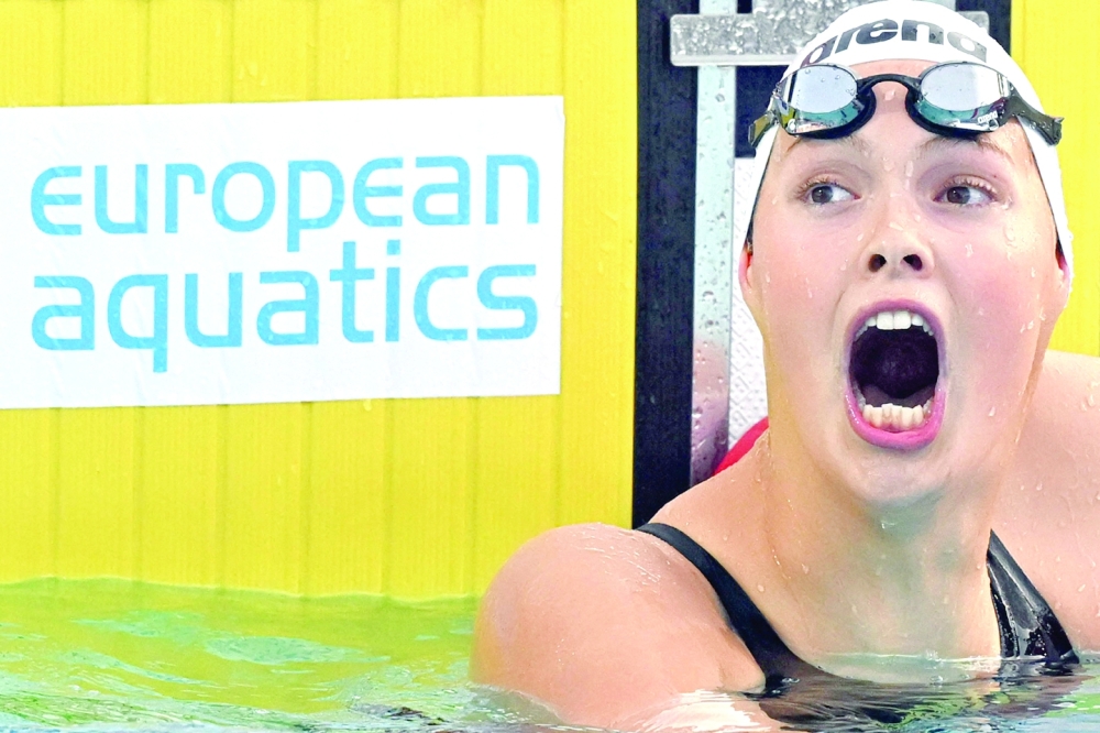 Bosnia's Lana Pudar reacts after winning the Women's 200m butterfly final event on August 17, 2022 during the LEN European Aquatics Championships in Rome. (Photo by Alberto PIZZOLI / AFP)

