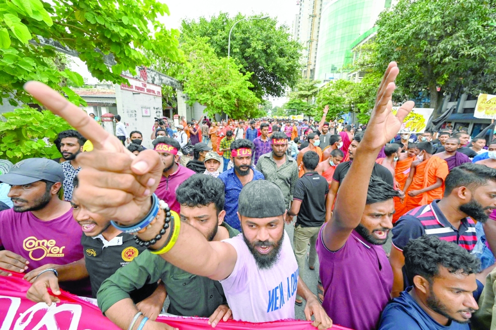 Sri Lankan university students take part in a demonstration in Colombo on Thursday. Sri Lanka police fired tear gas and water cannon on a small protest on Thursday to break up the first demonstration since the crisis-hit island nation lifted a state of emergency. - AFP