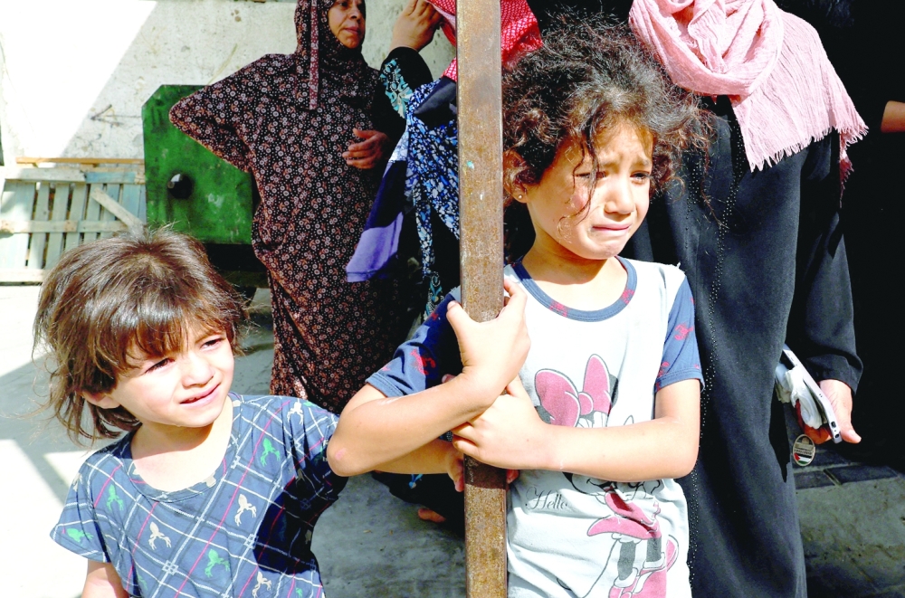 Palestinian children react, as another round of violence intensifies mental health crisis for Gaza children, in Gaza City. - Reuters