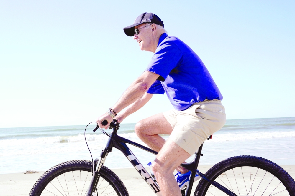 US President Joe Biden rides a bicycle on Kiawah Island, South Carolina. — Reuters