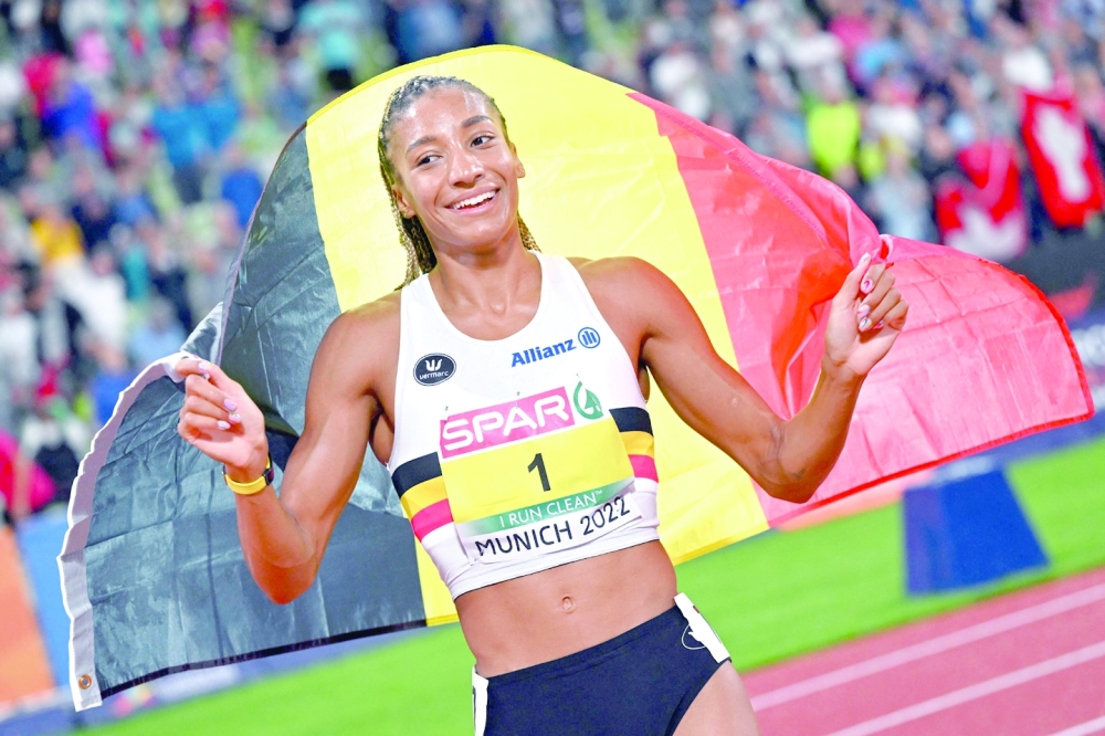 Belgium's Nafissatou Thiam celebrates winning gold in the women's Heptathlon during the European Athletics Championships at the Olympic Stadium in Munich, southern Germany on August 18, 2022. (Photo by ANDREJ ISAKOVIC / AFP)

