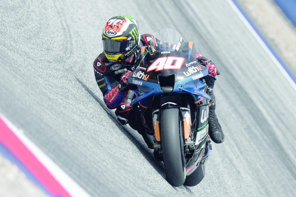 TOPSHOT - WithU Yamaha RNF's South African rider Darryn Binder rides during the fourth free practice session of the MotoGP Austrian Grand Prix at the Redbull Ring racetrack in Spielberg on August 20, 2022.  (Photo by VLADIMIR SIMICEK / AFP)