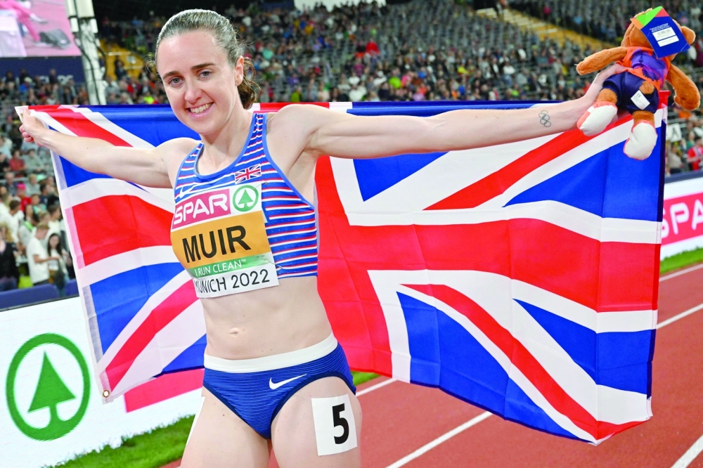 Britain's Laura Muir celebrates winning the gold medal in the women's 1500m final during the European Athletics Championships at the Olympic Stadium in Munich, southern Germany on August 19, 2022.  (Photo by ANDREJ ISAKOVIC / AFP)

