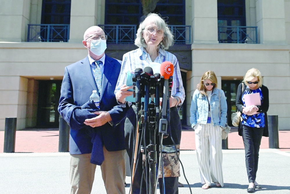 Paula and Ed Kassig, the parents of hostage Peter Kassig, speaks to reporters outside the Albert V Bryan Federal Courthouse. - AFP