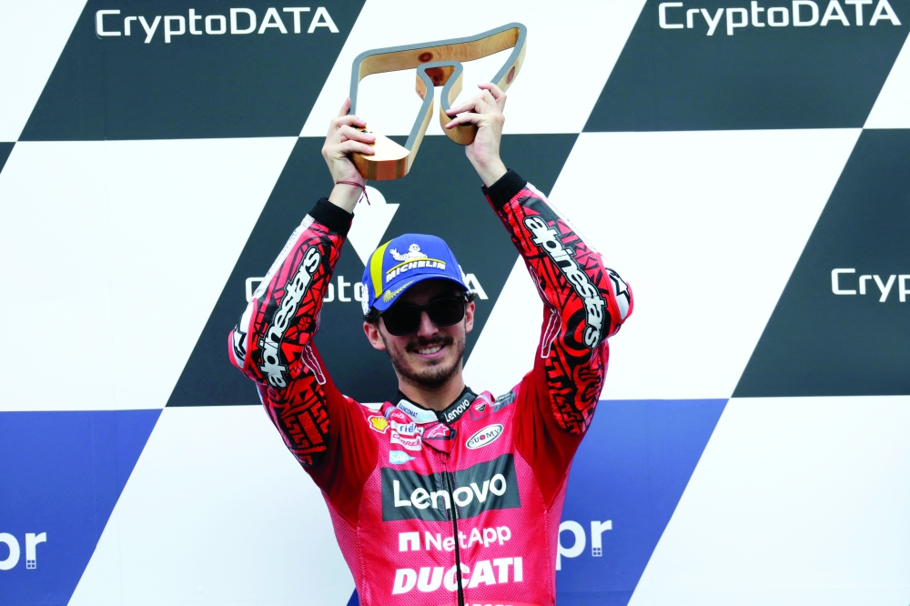 MotoGP - Austrian Grand Prix - Red Bull Ring, Spielberg, Austria - August 21, 2022 Ducati Lenovo's Francesco Bagnaia celebrates on the podium with the trophy after winning the race REUTERS/Leonhard Foeger
