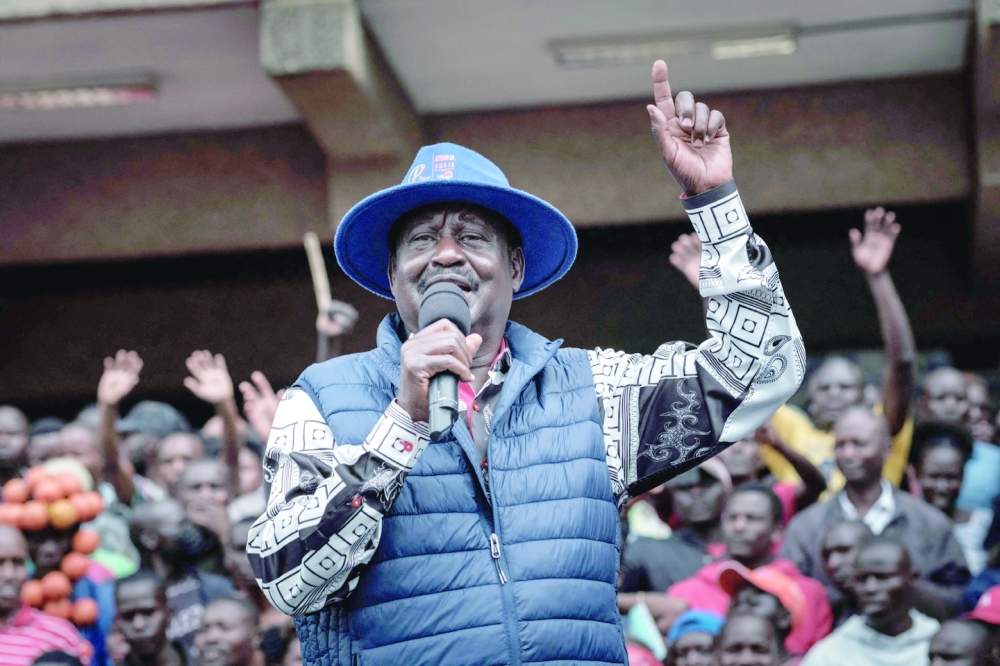 Kenya's defeated presidential candidate Raila Odinga speaks to supporters at the Kenyatta International Convention Centre in Nairobi after filing a petition to the country's top court. - AFP
