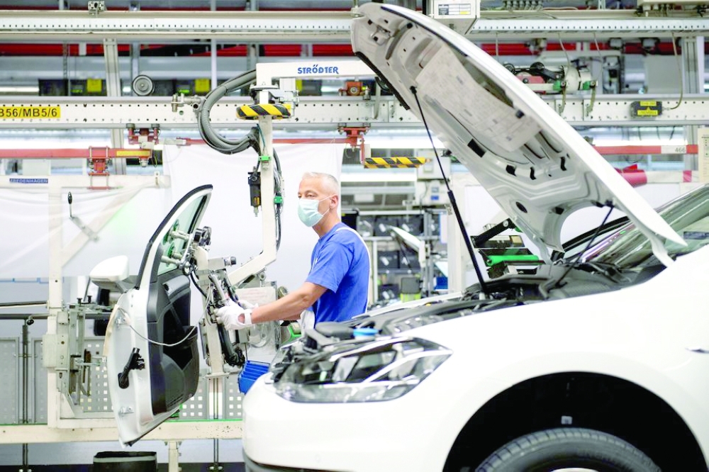 A man works at Volkswagen assembly line in Wolfsburg, Germany. — Reuters