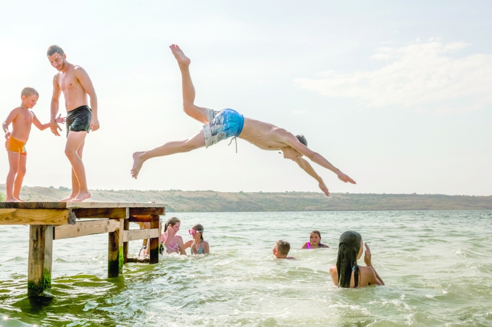 Visitors swim near Oysterville, a small cafe and beach resort on the Odesa side of the Tylihul Estuary, Ukraine.