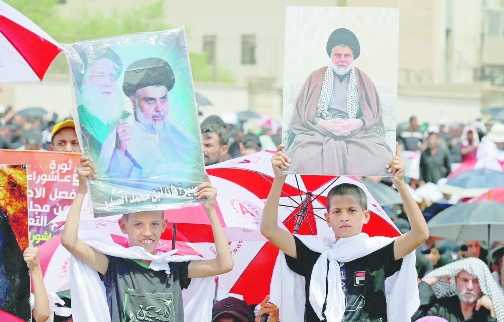 Supporters of Sadr during their vigil outside parliament headquarters. - AFP