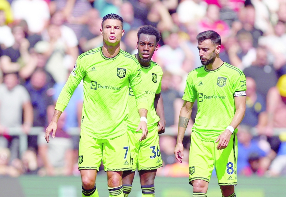 Soccer Football - Premier League - Southampton v Manchester United - St Mary's Stadium, Southampton, Britain - August 27, 2022 Manchester United's Cristiano Ronaldo, Anthony Elanga and Bruno Fernandes REUTERS/Hannah Mckay EDITORIAL USE ONLY. No use with unauthorized audio, video, data, fixture lists, club/league logos or 'live' services. Online in-match use limited to 75 images, no video emulation. No use in betting, games or single club /league/player publications.  Please contact your account representative for further details.

