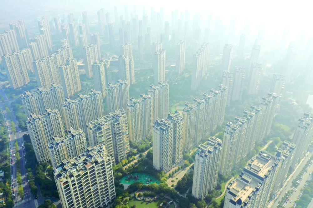 Aerial photo shows buildings of China's developer Country Garden Holdings in Zhenjiang, in China's eastern Jiangsu province. China's largest developer Country Garden Holdings reported a record 96 percent on-year drop in its first-half earnings, in the latest grim illustration of the economic chaos coursing through the country's property sector. -- AFP
