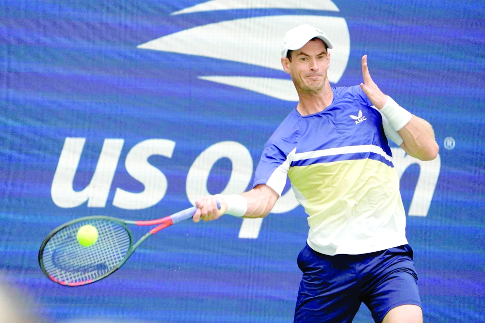 Britain's Andy Murray hits a return to Emilio Nava of the US during their 2022 US Open Tennis tournament men's singles second round match at the USTA Billie Jean King National Tennis Center in New York, on August 31, 2022. (Photo by TIMOTHY A. CLARY / AFP)

