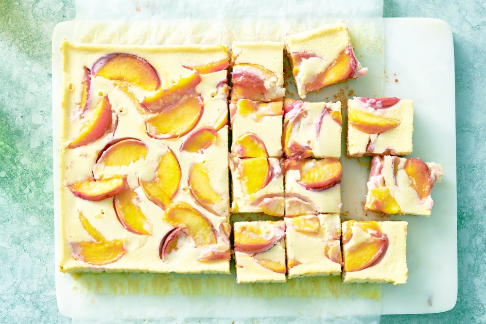 Creamy peach bars, in New York, Aug. 18, 2022. Food styled by Simon Andrews. (David Malosh/The New York Times)