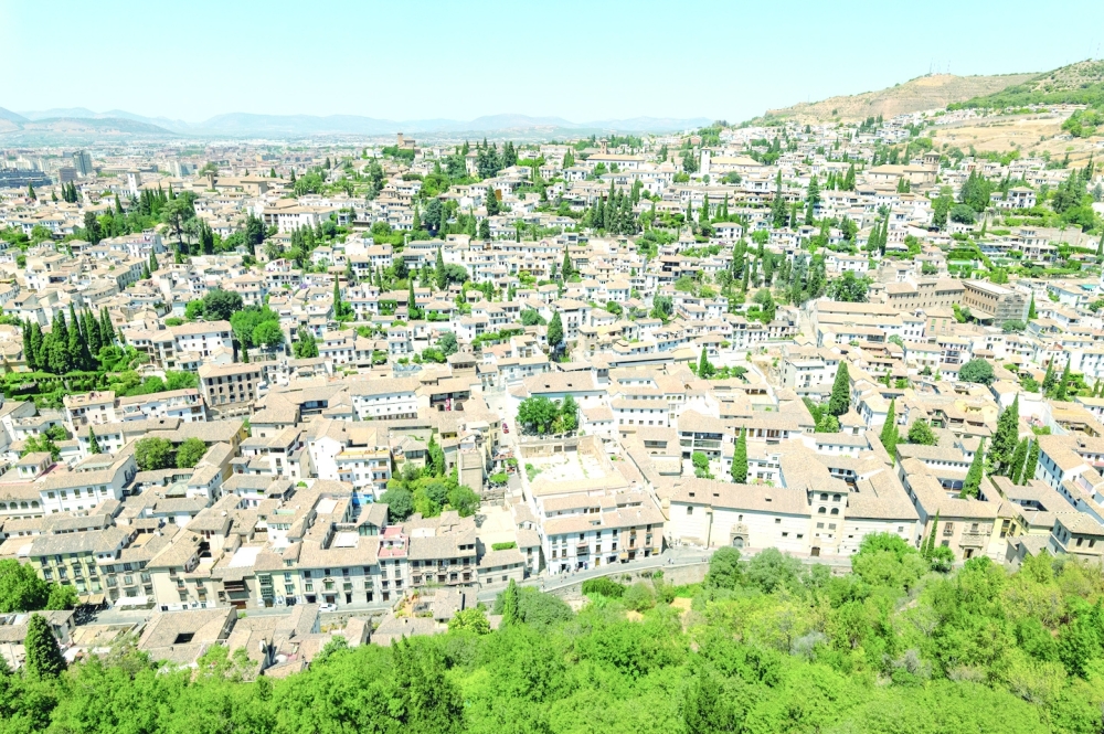 A view of Granda, Spain on Aug. 7, 2022. The city bustles with university students, tapas bars, outdoor cafes, a shopping district and even a covered souk. (Emilio Parra Doiztua/The New York Times)