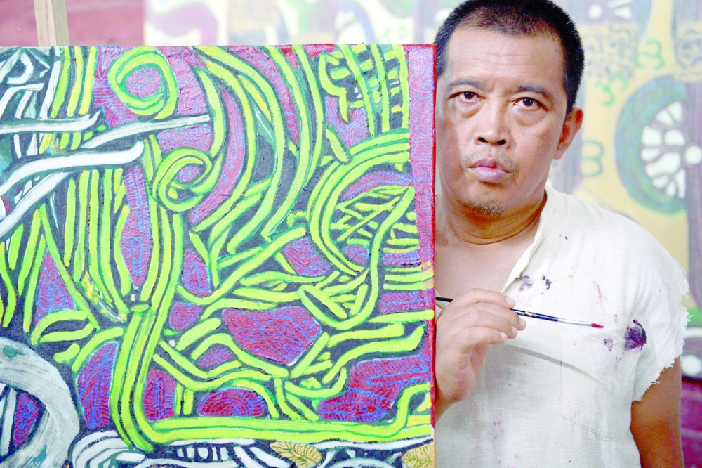 Prominent Myanmar artist Htein Lin, seen here in 2015, and his wife, a former British diplomat, have been sentenced to a year each in prison by a junta court. -- AFP