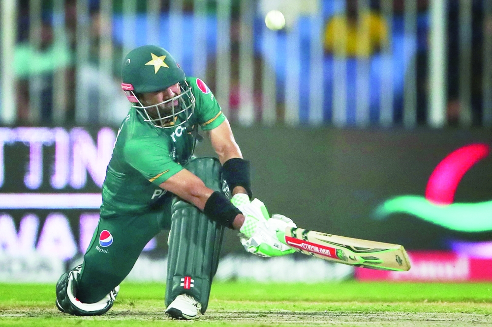 Pakistan's Mohammad Rizwan plays a shot during the Asia Cup Twenty20 international cricket match between Pakistan and Hong Kong at the Sharjah Cricket Stadium in Sharjah on September 2, 2022. (Photo by Surjeet Yadav / AFP)

