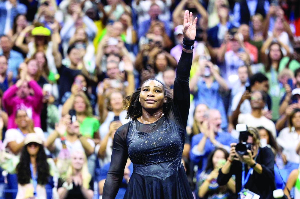 TOPSHOT - USA's Serena Williams waves to the audience after losing against Australia's Ajla Tomljanovic during their 2022 US Open Tennis tournament women's singles third round match at the USTA Billie Jean King National Tennis Center in New York, on September 2, 2022. (Photo by COREY SIPKIN / AFP)
