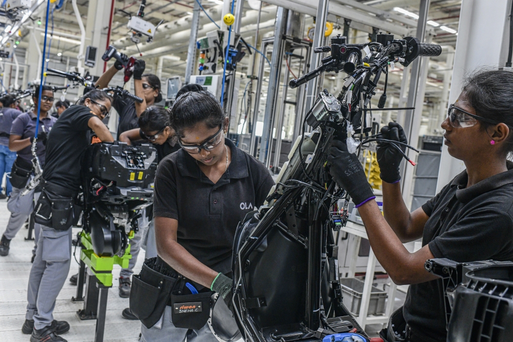 Women work at the Ola Electric factory in Pochampalli, near Bangalore, India, Aug. 24, 2022. (Atul Loke/The New York Times)