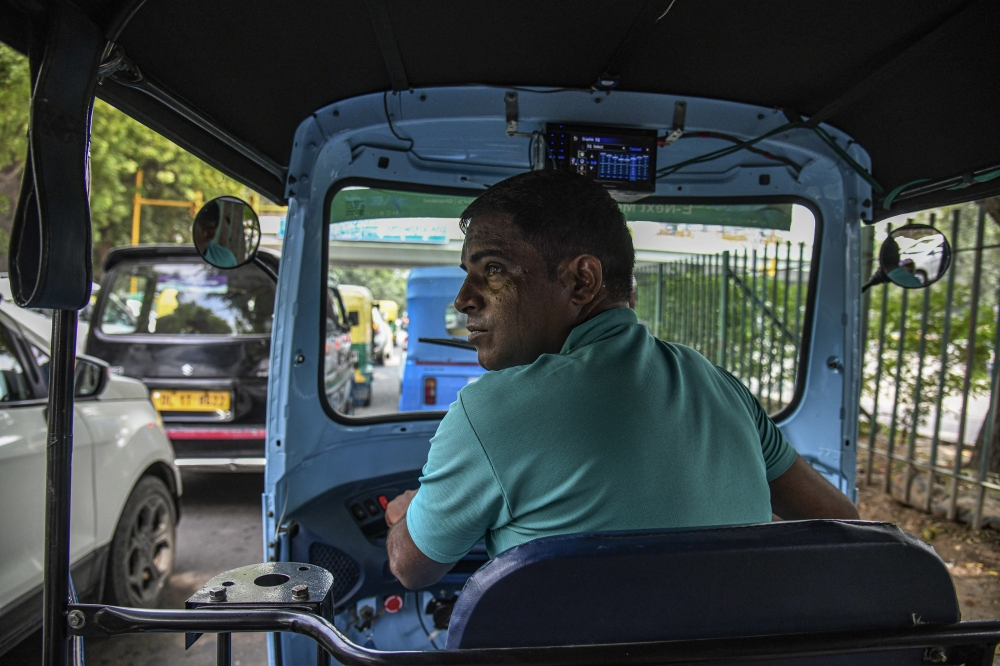 Kuldeep Singh, who drives an electric rickshaw in New Delhi, Aug. 26, 2022. (Atul Loke/The New York Times)