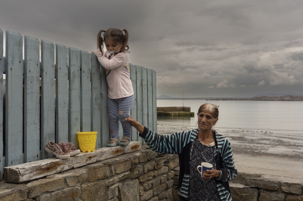 A Ukrainian woman minds a child at a hostel that hosts Ukrainian families on Arranmore, a small island off the coast of Donegal, Ireland. 