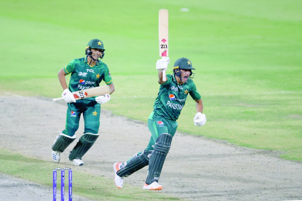 Pakistan's Naseem Shah (R) celebrates after hitting a boundary to win the Asia Cup Twenty20 international cricket Super Four match between Afghanistan and Pakistan at the Sharjah Cricket Stadium in Sharjah on September 7, 2022. (Photo by KARIM SAHIB / AFP)


