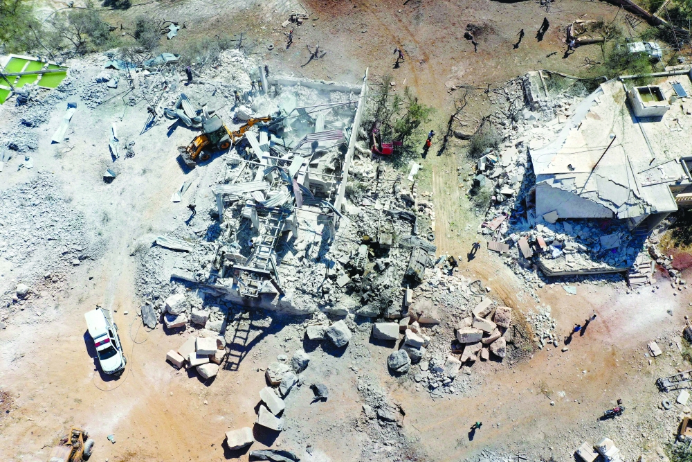 An aerial view shows the damaged buildings in Idlib. -- AFP

