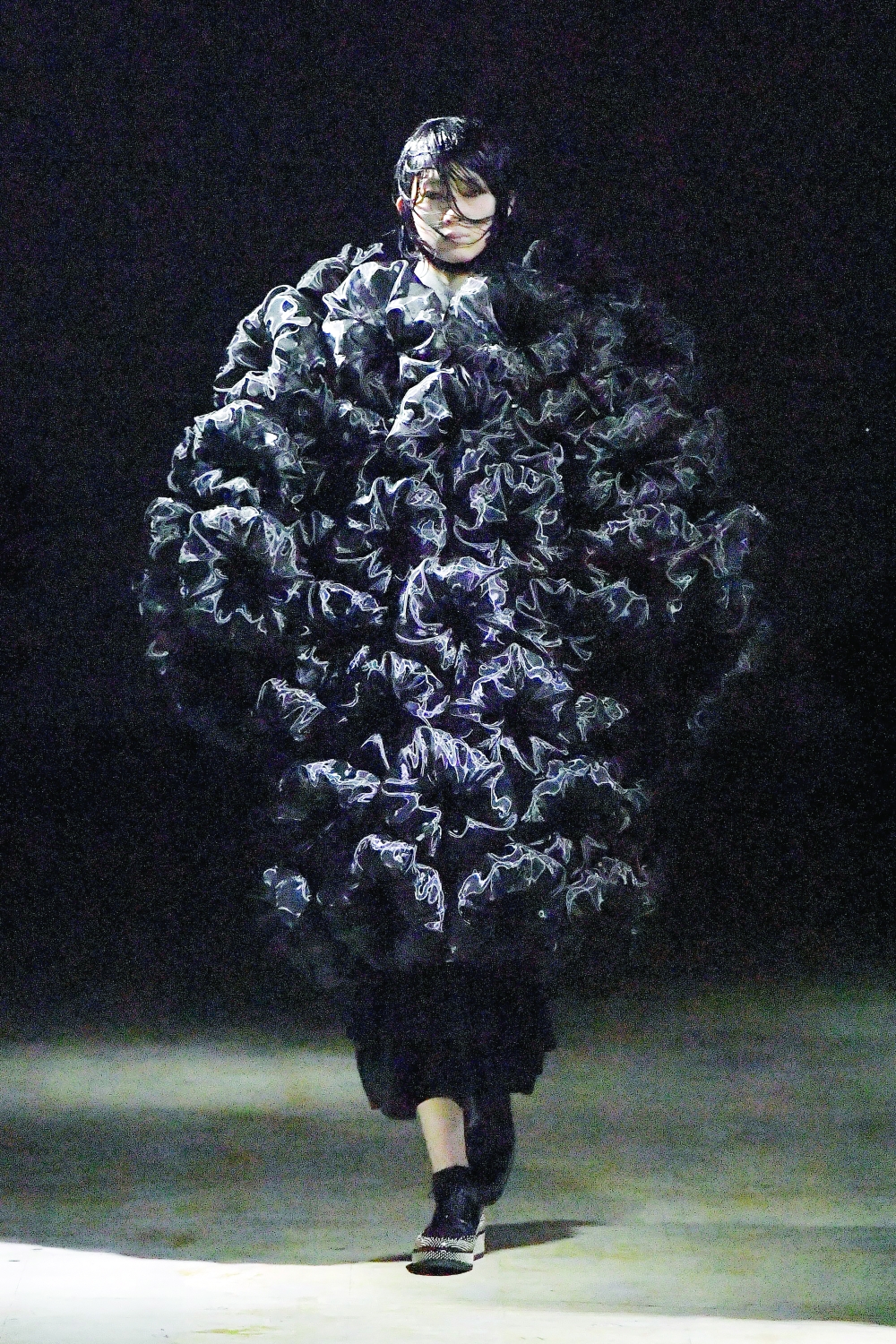 A model present looks for Kei Ninomiya of Noir during Fall 2021. (via Noir Kei Ninomiya via The New York Times)