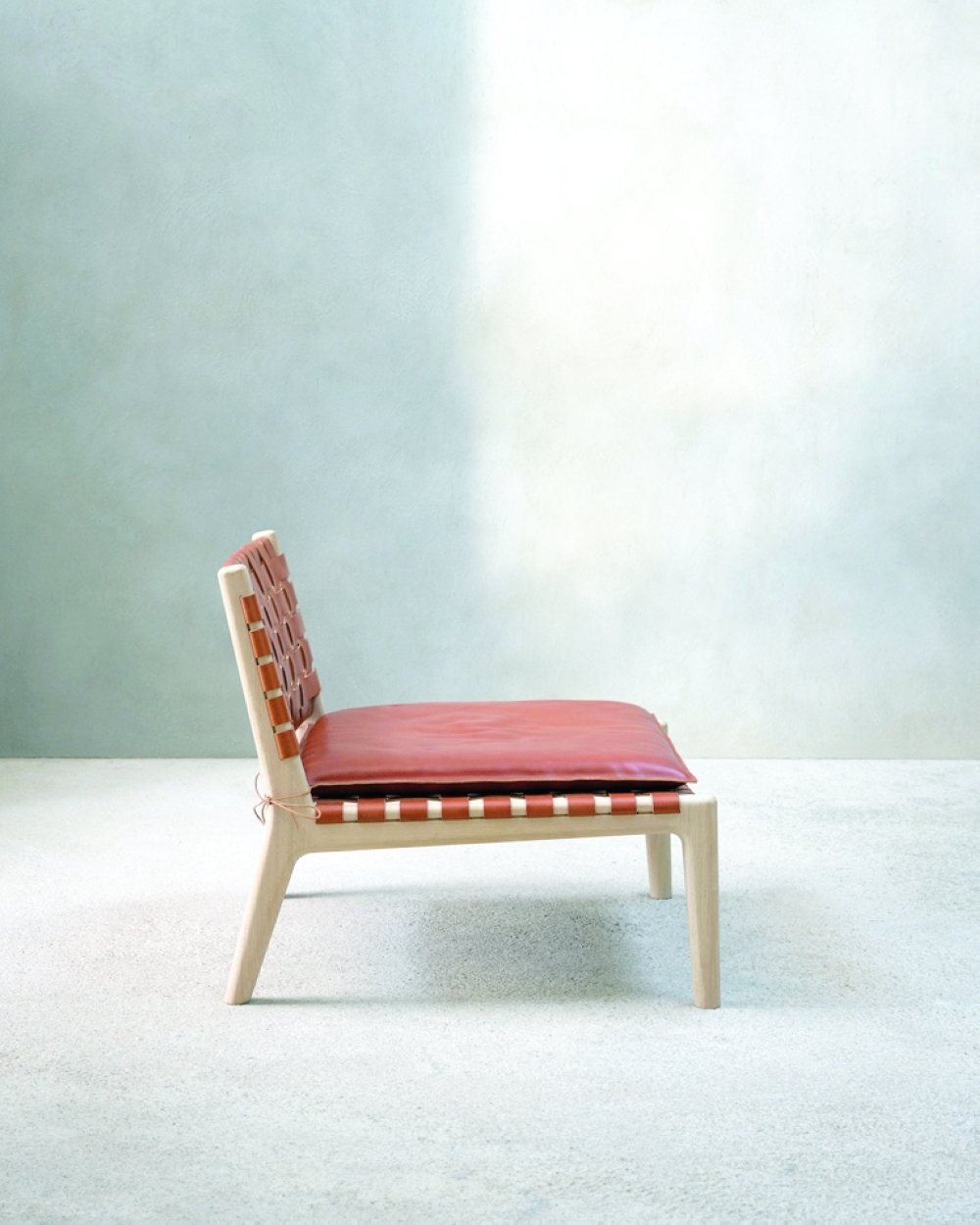 Zara opens up its repertoire with a line of home goods, including a lounge chair in oak and leather. (Frederik Vercruysse via The New York Times) 