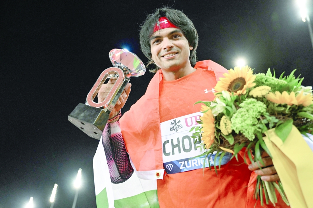 India's Neeraj Chopra celebrates after victory in the men's javelin final during the Diamond League athletics meeting at Stadion Letzigrund stadium in Zurich on September 8, 2022. (Photo by Fabrice COFFRINI / AFP)

