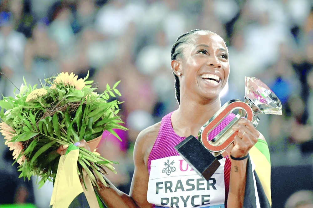 Jamaica's Shelly-Ann Fraser-Pryce celebrates after victory in the women's 100m final during the Diamond League athletics meeting at Stadion Letzigrund stadium in Zurich on September 8, 2022. (Photo by Fabrice COFFRINI / AFP)

